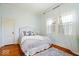 Cozy bedroom with hardwood floors, neutral walls, decorative rug and natural light at 5055 Willow Rd, Zionsville, IN 46077