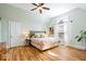 Bedroom with hardwood floors, vaulted ceilings, neutral walls, and natural light at 5055 Willow Rd, Zionsville, IN 46077