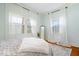 Light bedroom featuring hardwood floors, neutral walls, decorative rug and natural light at 5055 Willow Rd, Zionsville, IN 46077