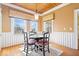 Sunny dining area with large windows, natural lighting, and traditional decor at 5055 Willow Rd, Zionsville, IN 46077