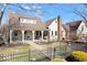 Charming home with a covered porch, landscaped front yard, and black iron fence at 5055 Willow Rd, Zionsville, IN 46077