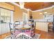 Charming kitchen and dining nook combination with natural wood features and ample seating space at 5055 Willow Rd, Zionsville, IN 46077