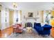 Comfortable living room with fireplace, hardwood floors, and plenty of natural light at 5055 Willow Rd, Zionsville, IN 46077