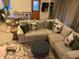 Cozy living room features a sectional sofa, ottoman, and round table and chairs perfect for relaxing or entertaining at 5055 Willow Rd, Zionsville, IN 46077