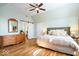 Spacious main bedroom features hardwood floors, a sliding barn door, and natural light at 5055 Willow Rd, Zionsville, IN 46077