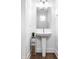 Bright bathroom with a pedestal sink, modern fixtures, and a clean, minimalist design at 606 E 10Th St, Indianapolis, IN 46202