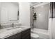 Clean bathroom featuring a vanity and tiled shower at 606 E 10Th St, Indianapolis, IN 46202