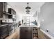 Modern kitchen with a large island, stainless steel appliances, and sleek dark cabinetry at 606 E 10Th St, Indianapolis, IN 46202