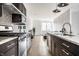 Modern kitchen design featuring granite countertops, stainless steel appliances, and hardwood floors at 606 E 10Th St, Indianapolis, IN 46202