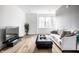 Cozy living room with hardwood floors and a view of the outdoors at 606 E 10Th St, Indianapolis, IN 46202