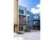 Modern townhome exterior showcasing multiple units with individual garages and private balconies at 606 E 10Th St, Indianapolis, IN 46202