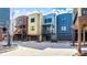 View of several townhomes featuring a cohesive architectural style with individual garages and balconies at 606 E 10Th St, Indianapolis, IN 46202