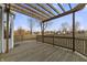 Enjoy outdoor living on this backyard deck, offering a cozy space with a wooden pergola overhead at 6311 Feather Run Dr, Indianapolis, IN 46237