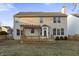 The rear exterior features a spacious yard and a beautiful deck with a pergola, perfect for outdoor enjoyment at 6311 Feather Run Dr, Indianapolis, IN 46237