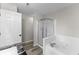 Clean bathroom with a white shower tub combination and granite vanity, offering a refreshing space at 6311 Feather Run Dr, Indianapolis, IN 46237