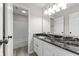 Well-lit bathroom features a single vanity with a granite countertop and shower-tub combination at 6311 Feather Run Dr, Indianapolis, IN 46237