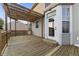 A wooden deck featuring a pergola with a door leading into the home at 6311 Feather Run Dr, Indianapolis, IN 46237