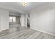 Open concept dining area with hardwood floors and easy access to kitchen at 6311 Feather Run Dr, Indianapolis, IN 46237
