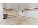 A spacious two car garage with overhead storage and a new garage door at 6311 Feather Run Dr, Indianapolis, IN 46237