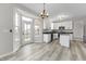 Charming kitchen features white cabinets, black countertops, stainless appliances, and a breakfast nook at 6311 Feather Run Dr, Indianapolis, IN 46237
