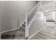 Elegant staircase with carpeted steps and white railing, leading to the upper level at 6311 Feather Run Dr, Indianapolis, IN 46237