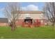 Spacious backyard featuring a well-maintained lawn, wooden deck with gazebo, and mature trees at 6333 Silver Moon Ct, Indianapolis, IN 46259