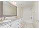 Bright bathroom with a dual sink vanity with granite countertop and marble-style floors at 6333 Silver Moon Ct, Indianapolis, IN 46259