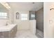 Modern bathroom featuring marble floors, updated vanity, and a frameless glass shower at 6333 Silver Moon Ct, Indianapolis, IN 46259