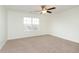Bedroom with carpet, ceiling fan, and a window providing an outside view at 6333 Silver Moon Ct, Indianapolis, IN 46259