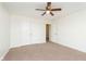 Bedroom with carpet, ceiling fan, double closet, and access to another room at 6333 Silver Moon Ct, Indianapolis, IN 46259