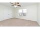 Bedroom with carpet, ceiling fan, a large window, and a double-door closet at 6333 Silver Moon Ct, Indianapolis, IN 46259