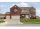 Classic brick two-story home with attached garages, front lawn, and inviting curb appeal at 6333 Silver Moon Ct, Indianapolis, IN 46259