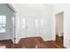 Bright foyer with hardwood floors, white trim, and front door with sidelights at 6333 Silver Moon Ct, Indianapolis, IN 46259