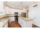Modern kitchen features granite countertops, stainless steel appliances, and a center island at 6333 Silver Moon Ct, Indianapolis, IN 46259