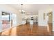 Open-concept dining area leading to a modern kitchen with sliding door to the outdoor deck at 6333 Silver Moon Ct, Indianapolis, IN 46259