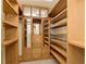 Spacious walk-in closet with custom wooden storage solutions at 6333 Silver Moon Ct, Indianapolis, IN 46259