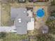 Overhead view of the property showcasing the home, backyard with pool, and ample driveway space at 6412 Lava Ct, Indianapolis, IN 46237