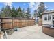 Spacious backyard patio featuring a wooden fence and a relaxing hot tub area at 6412 Lava Ct, Indianapolis, IN 46237
