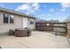 Backyard patio featuring a hot tub and a wood fence with accents at 6412 Lava Ct, Indianapolis, IN 46237