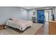 Bedroom with neutral colors and a sliding glass door to a workout room at 6412 Lava Ct, Indianapolis, IN 46237