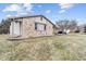 View of the side exterior highlighting the stone accents, neutral siding, and well-maintained landscaping at 6412 Lava Ct, Indianapolis, IN 46237