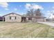 Charming stone home with an attached garage, mature landscaping and a cozy front porch seating area at 6412 Lava Ct, Indianapolis, IN 46237