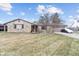 Charming stone home with an attached garage, mature landscaping and a cozy front porch seating area at 6412 Lava Ct, Indianapolis, IN 46237