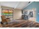 Open-concept living room with hardwood floors, a kitchen, and natural light at 6412 Lava Ct, Indianapolis, IN 46237