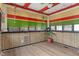 Unique sunroom with bamboo-style accents, vibrant blinds, and a fan with light at 6412 Lava Ct, Indianapolis, IN 46237
