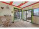Sunroom with slider door, colorful accents and bamboo-style wall at 6412 Lava Ct, Indianapolis, IN 46237