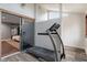 Treadmill in a workout room with a sliding glass door and window at 6412 Lava Ct, Indianapolis, IN 46237