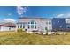 Spacious backyard showcasing well-maintained lawn, mature trees, and a comfortable patio area for relaxing and entertaining at 6481 W Treeline Ln, McCordsville, IN 46055