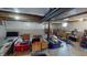 Unfinished basement with open ceiling, and multiple storage bins at 6481 W Treeline Ln, McCordsville, IN 46055
