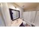 Functional bathroom with a combined shower and tub, vanity, and a large framed mirror at 6481 W Treeline Ln, McCordsville, IN 46055